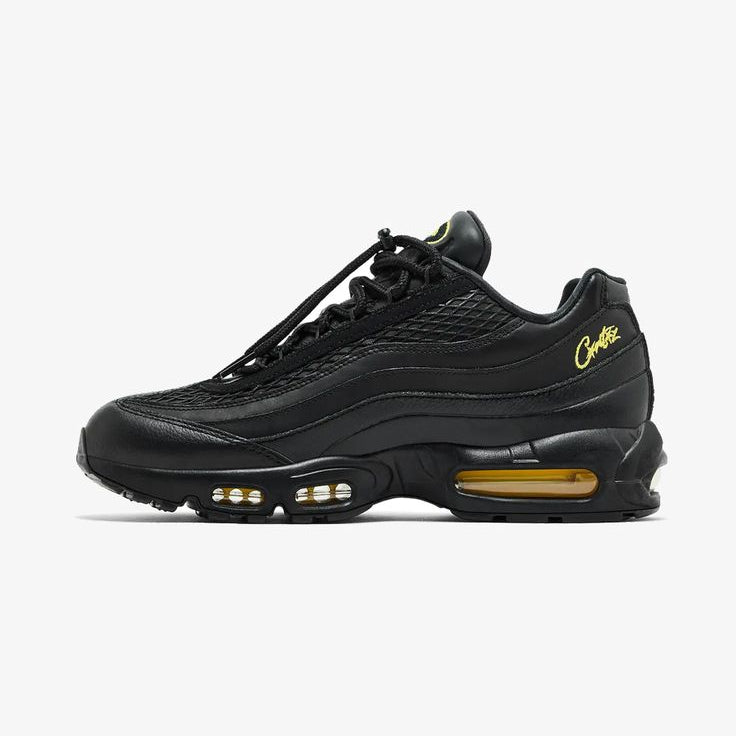 Black sneaker with a white sole on a white background