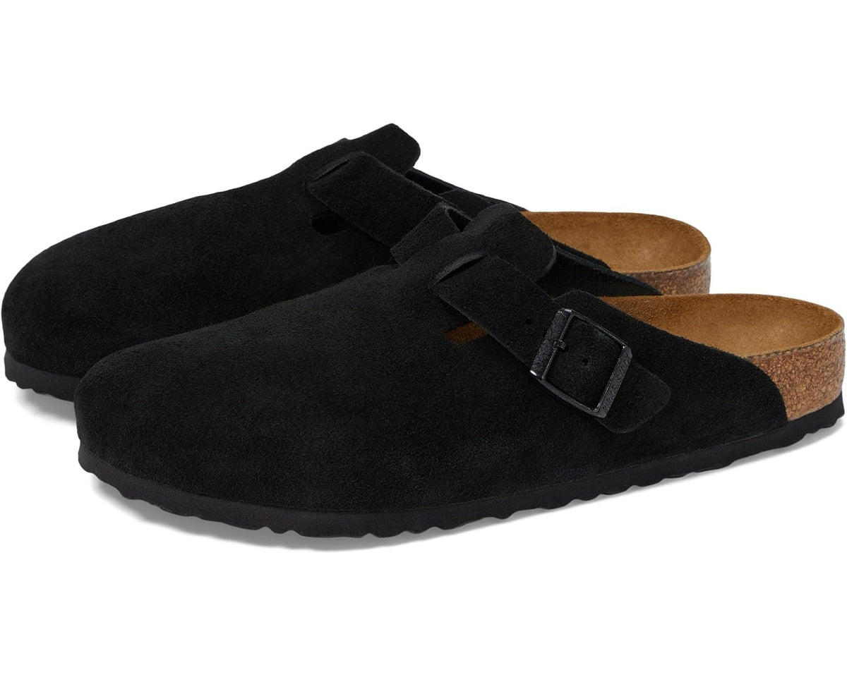 Black suede clogs with cork sole on a white background